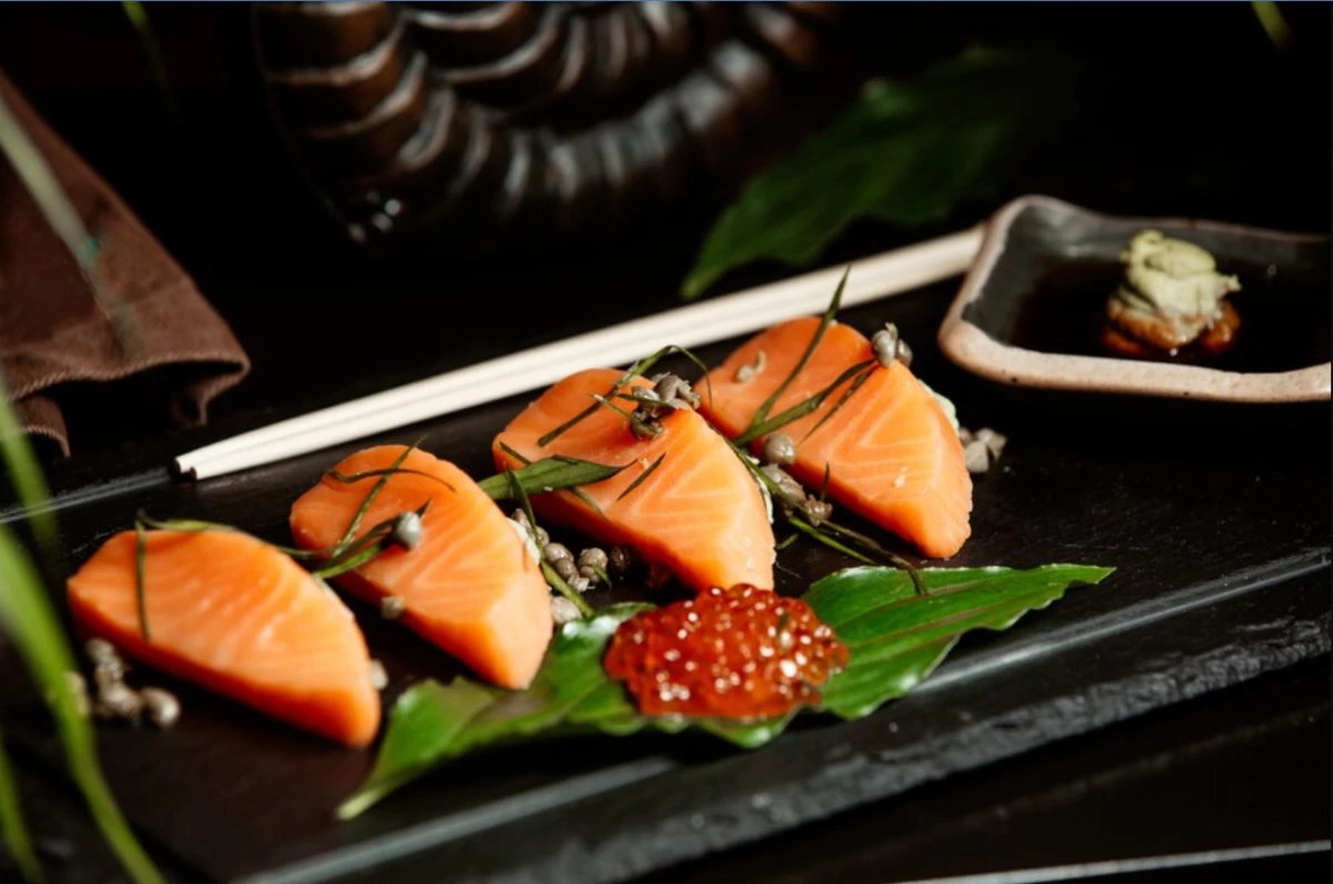 Close up of salmon sashimi served with red tobiko